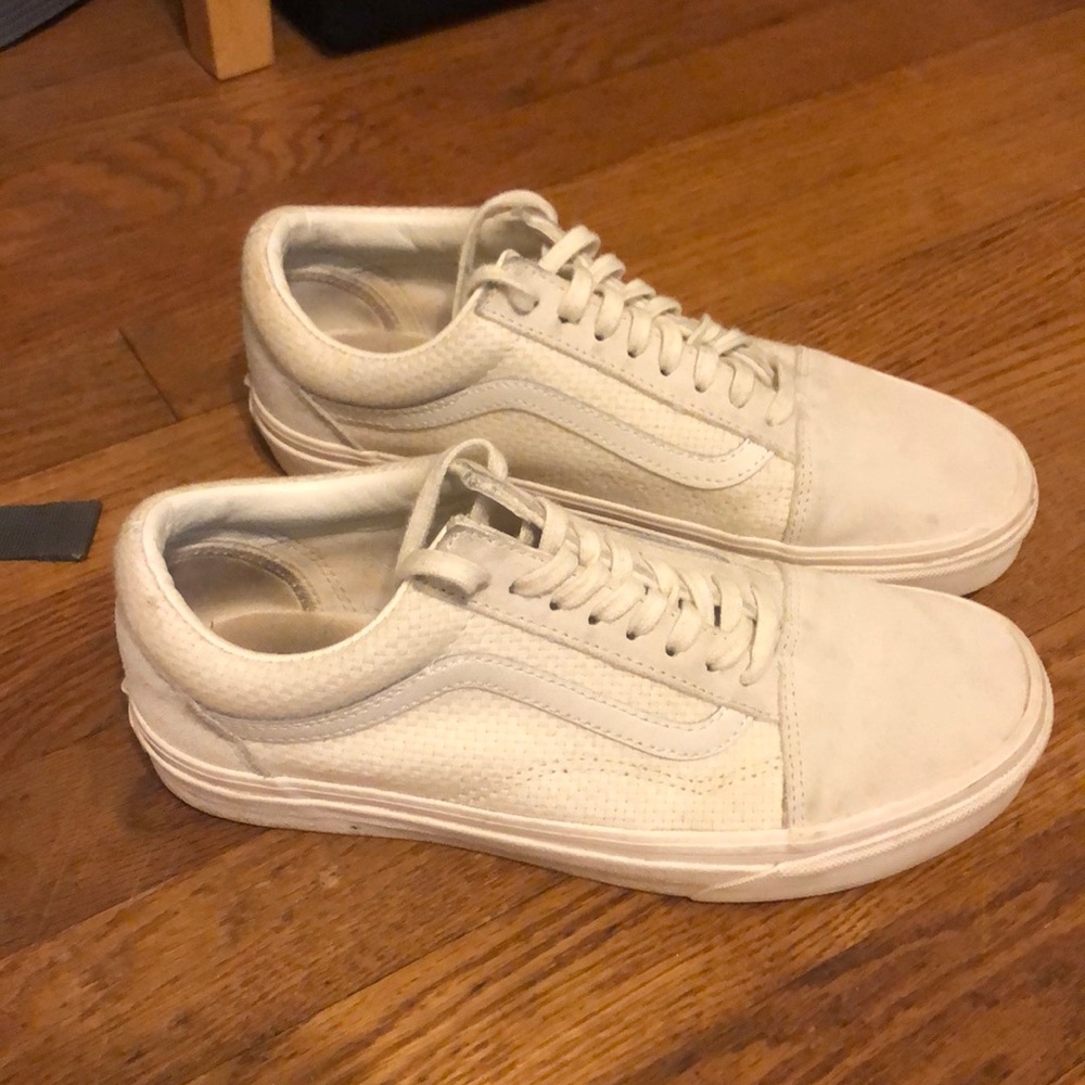 Cream colored vans with quilted detail.